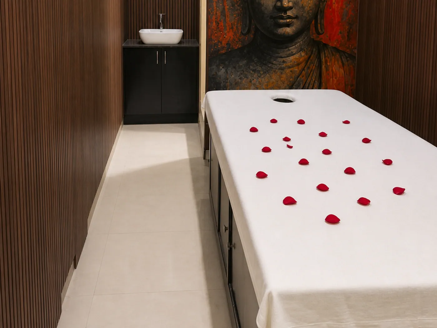 Treatment room with Buddha artwork at Liora Wellness Spa